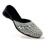Women's flat juttis wholesale featuring intricate pearl and rhinestone floral embellishments on a classic ethnic flat shoe.