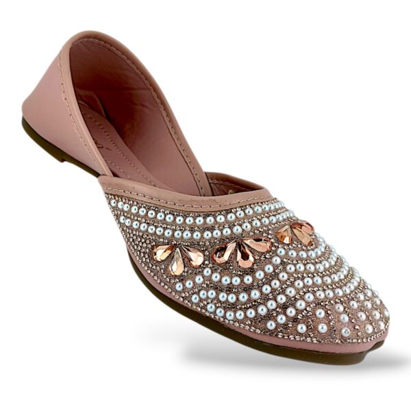 Women's flat juttis wholesale featuring intricate pearl and rhinestone floral embellishments on a classic ethnic flat shoe.