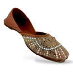 Traditional women's flat juttis wholesale with intricate pearl embellishments and detailed beadwork on the upper.