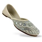 Traditional ethnic footwear featuring women's flat juttis wholesale with detailed rhinestone and bead embellishments.