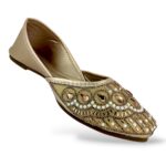 Traditional ethnic footwear featuring women's flat juttis wholesale with detailed rhinestone and bead embellishments.