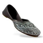 Traditional ethnic footwear featuring women's flat juttis wholesale with detailed rhinestone and bead embellishments.