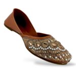 Traditional ethnic footwear featuring women's flat juttis wholesale with detailed rhinestone and bead embellishments.