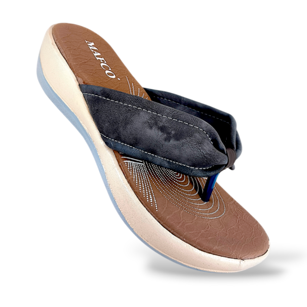 Comfortable women's wedge slippers wholesale featuring a textured cushioned sole and a wide padded strap.