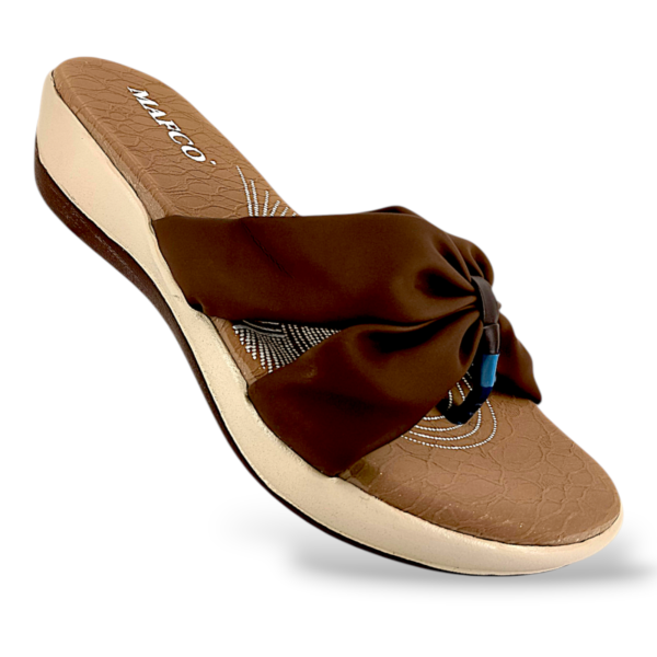 Women's wedge sandals wholesale with a textured footbed and a soft, gathered strap design.