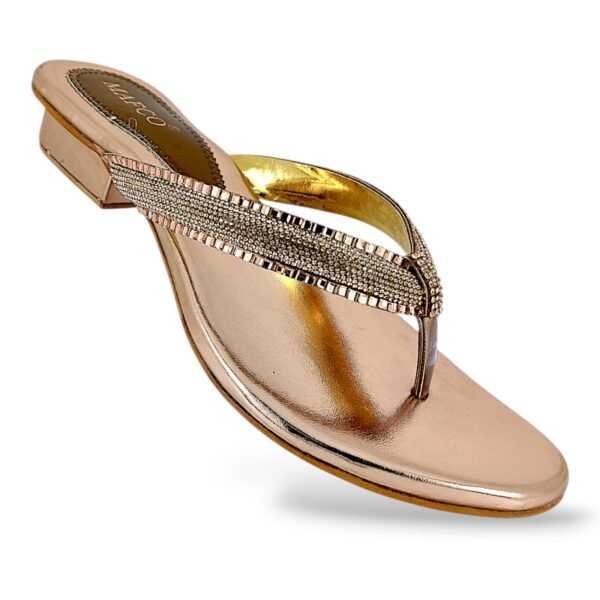 Women's low heel sandals wholesale featuring a metallic slip-on sole and a glittery rhinestone-embellished V-strap.