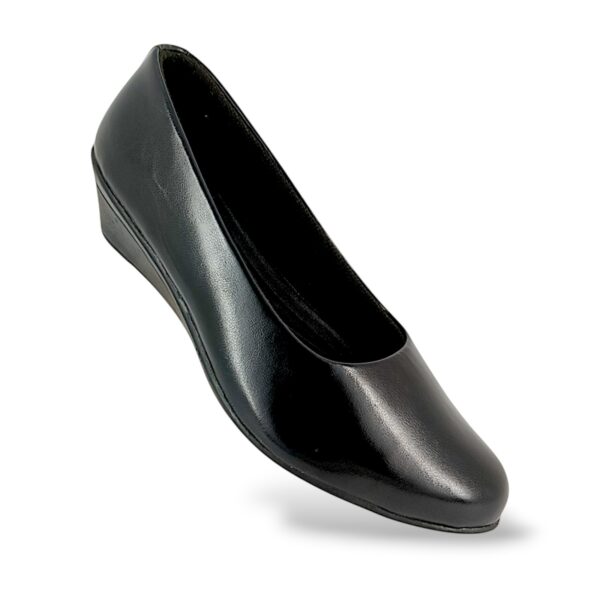 Closed-toe women's wedge shoes wholesale with a comfortable low wedge heel and smooth slip-on design.